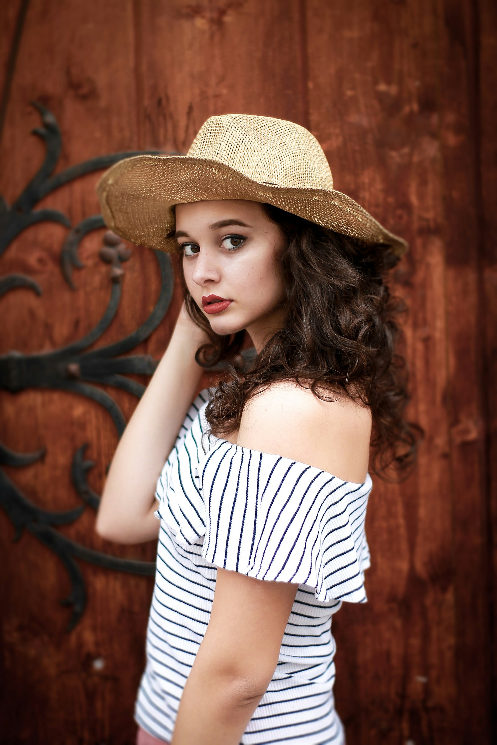 woman wearing white and black striped top